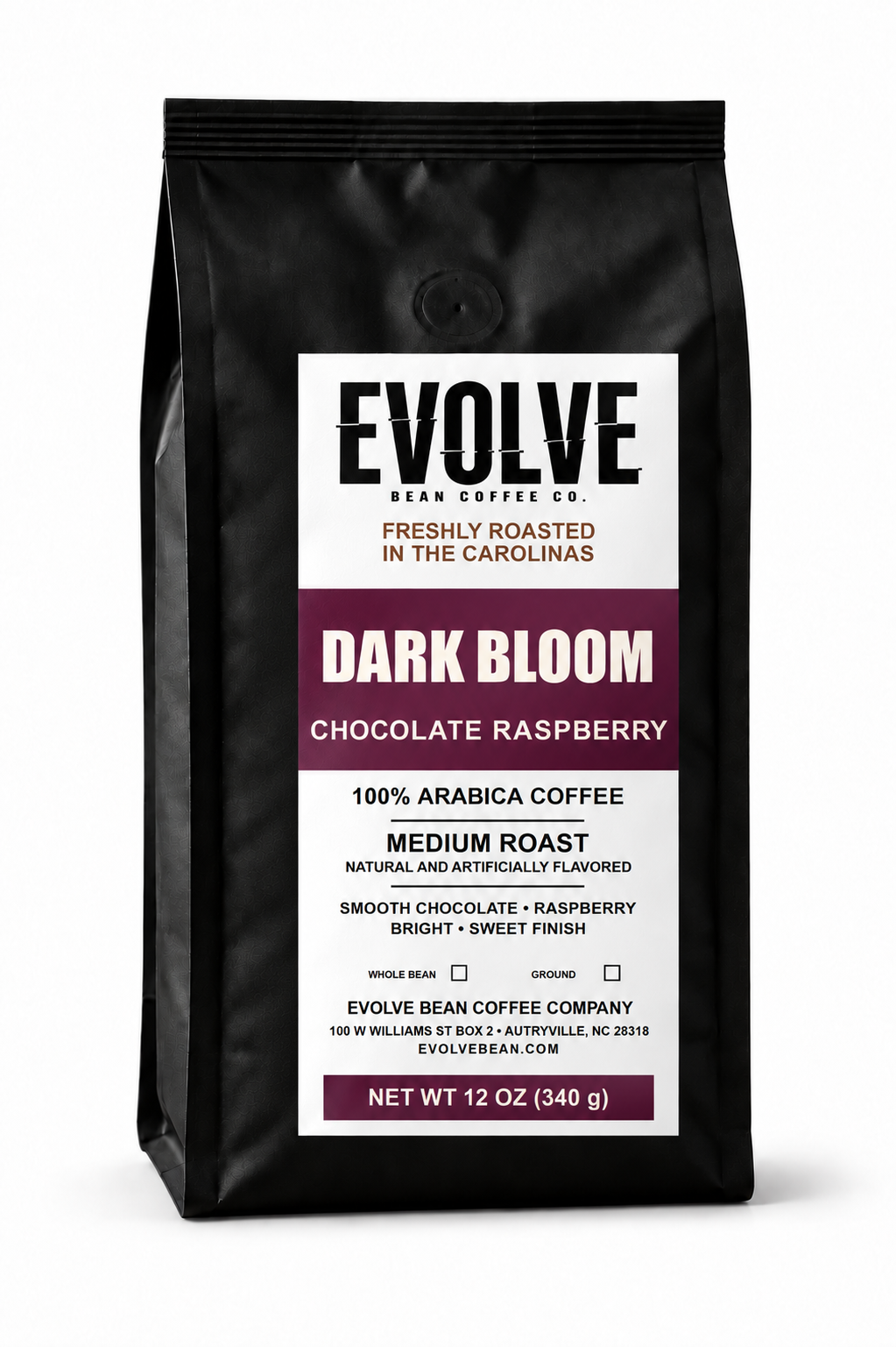 A 12 oz bag of Evolve Bean Coffee Company Dark Bloom Chocolate Raspberry coffee, in a matte black bag with a white and dark purple label.